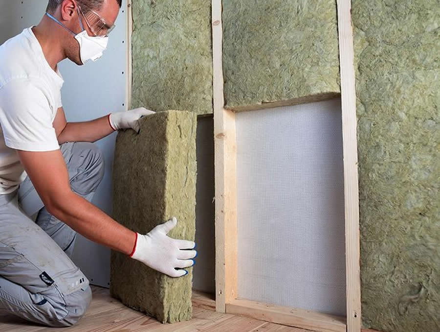 Acoustic mineral wool fitted inside timber stud wall