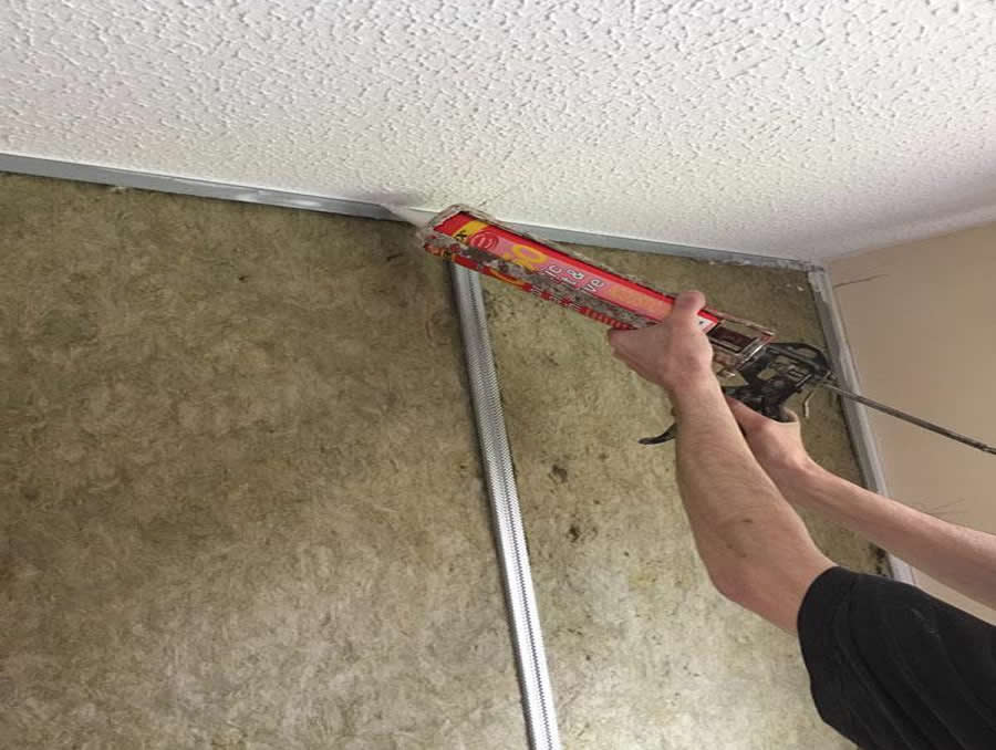 Acoustic sealant applied to wall joints