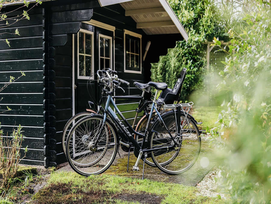 Family bicycle storage inside a timber side store