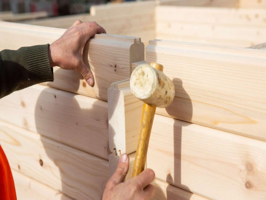 Interlocking tongue and groove timber wall logs