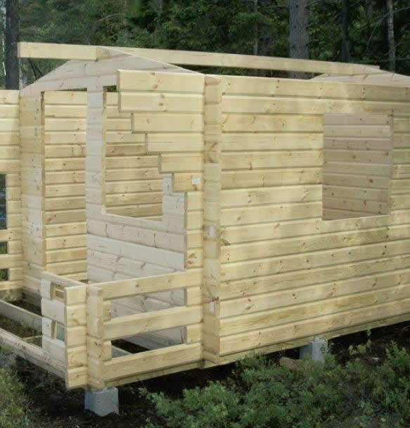 Internal timber partition construction inside a log cabin