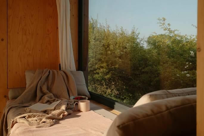 Large windows providing natural light inside a garden building