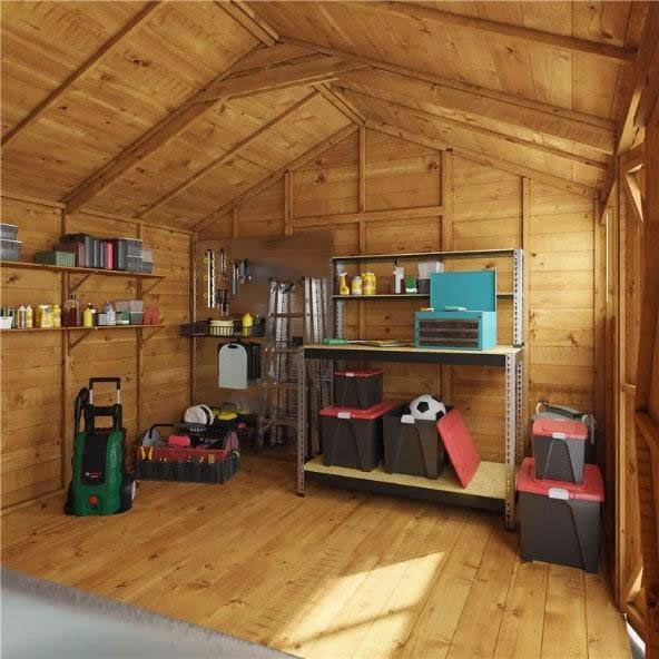 Ride-on mower stored inside an integrated side shed