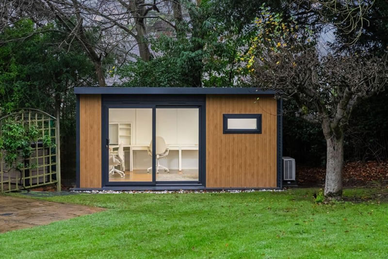 Compact garden office cabin in a small garden