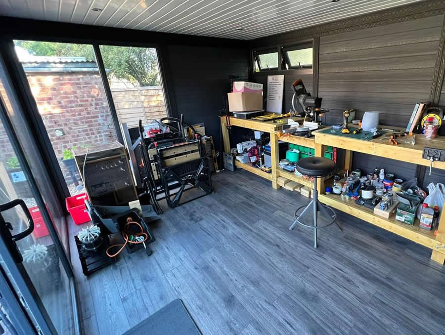 Workshop separated from office by acoustic partition