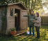 Couple discussing wooden garden cabin exterior