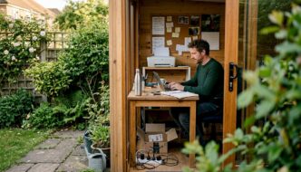 Man working inside a garden office shed