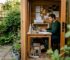 Man working inside a garden office shed