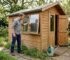 Man opening window for garden cabin ventilation